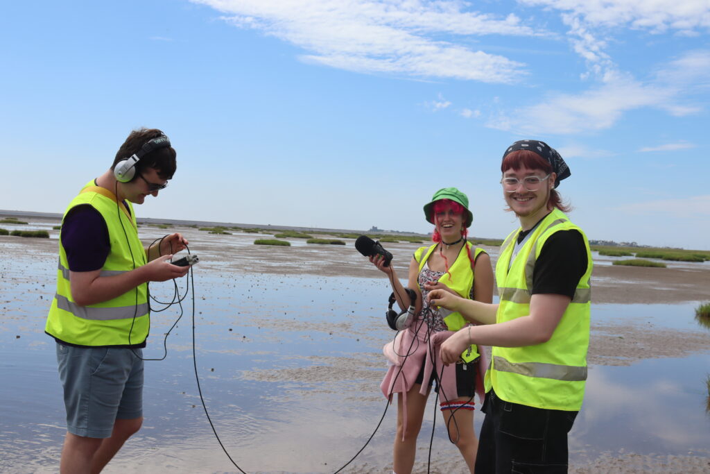 Young participants experimenting with sound equipment